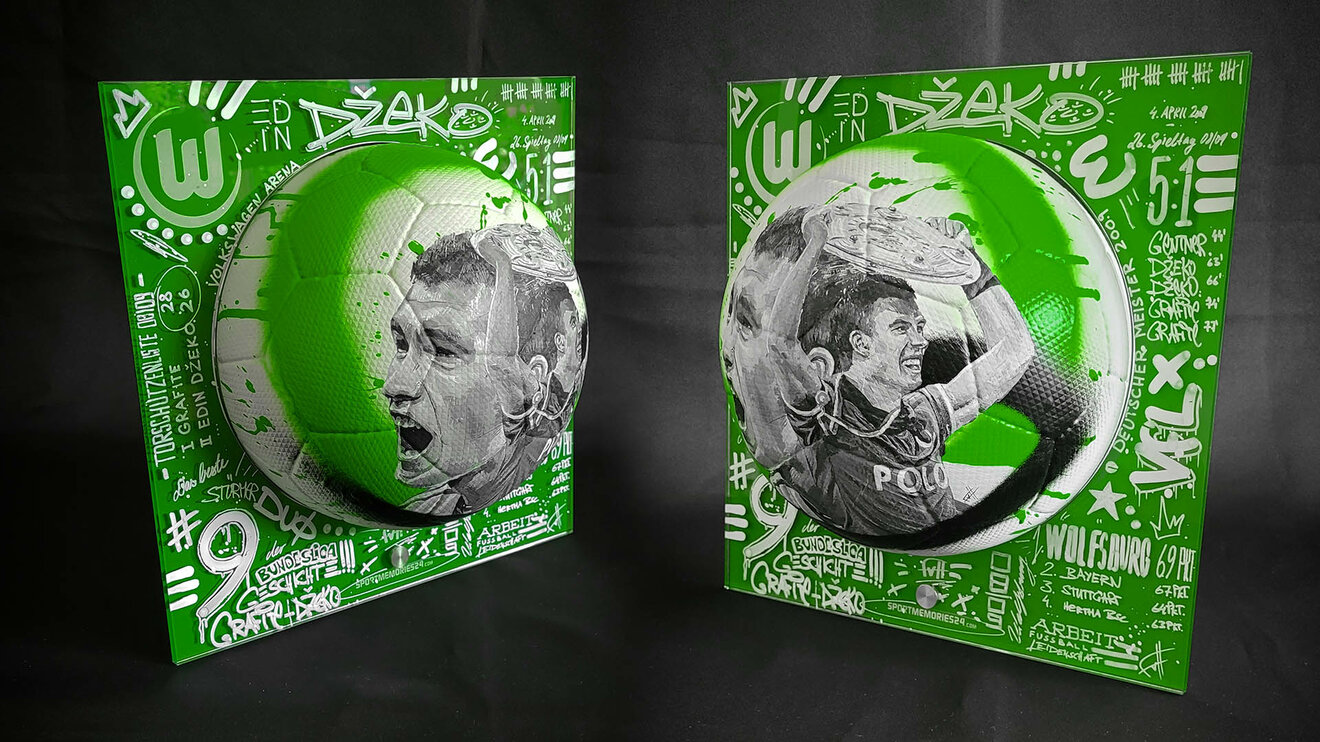Ein Kunstwerk mit einem bemalten Ball mit dem Gesicht des Meisterhelden Dzeko.