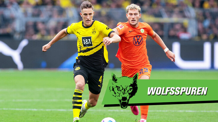 Eine Grafik zu den Wolfsspuren, die VfL-Wolfsburg-Spieler Jonas Wind im Zweikampf zeigt. Sein Gegenspieler ist Nico Schlotterbeck, Spieler des BVB.