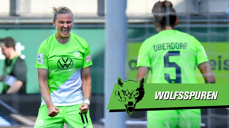 VfL Wolfsburg Spielerin Popp jubelt euphorisch, die Hände zu Fäusten geballt. Im Vordergrund, mit dem Rücken zur Kamera, steht ihre Teamkollegin Oberdorf.