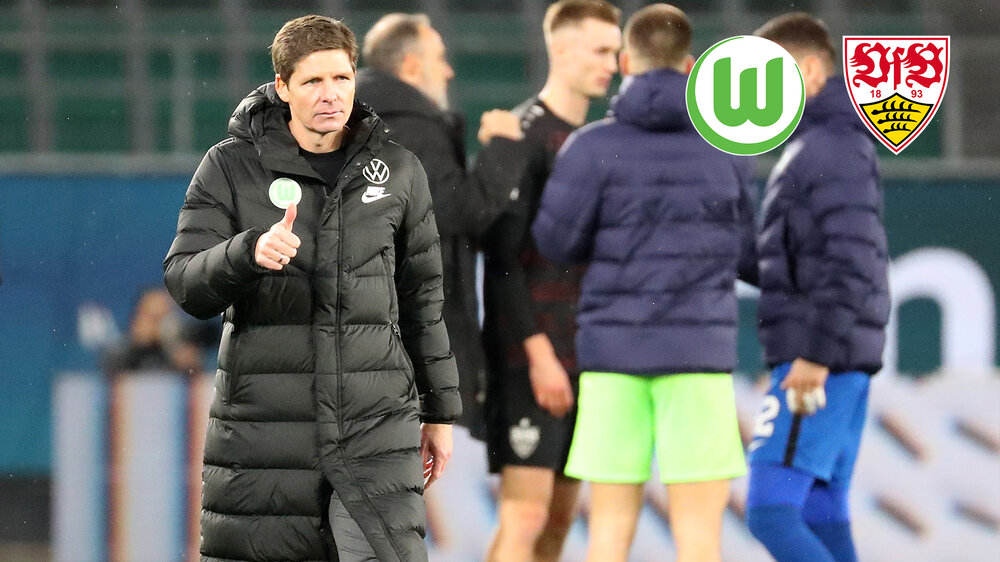 VfL Wolfsburgs Trainer zeigt seinen Daumen nach oben.