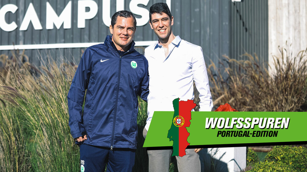 VfL-Wolfsburg-Sportdirektor Marcel Schäfer und Ex-Wolf Felipe Lopes stehen Arm in Arm und lächeln in die Kamera.