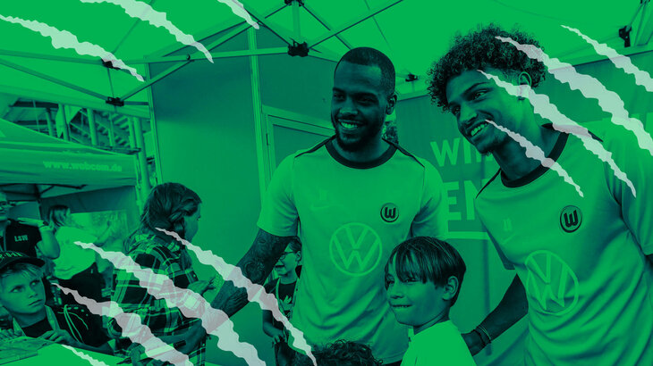 Eine VfL-Wolfsburg-Grafik mit Lukas Nmecha und Kevin Paredes, die ein Foto mit Kindern machen.