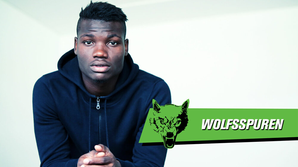 Eine Grafik für die Wolfsspuren mit einem Bild des verstorbenen VfL Wolfsburg Profis Junior Malanda anlässlich seines neunten Todetags.