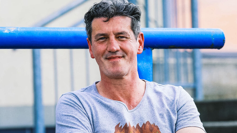 Ehemaliger Leiter des VfL-Wolfsburg-Nachwuchsleistungszentrums Jens Todt lächelt.