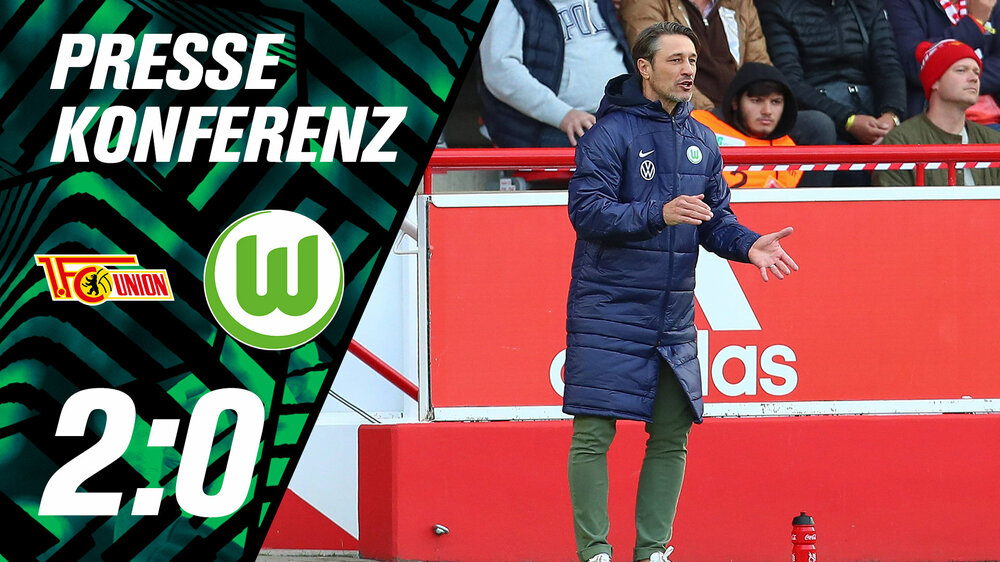 Niko Kovac steht am Spielfeldrand. Links sind die Logos von Union Berlin und des VfL Wolfsburg sowei der Endstand 2:0.