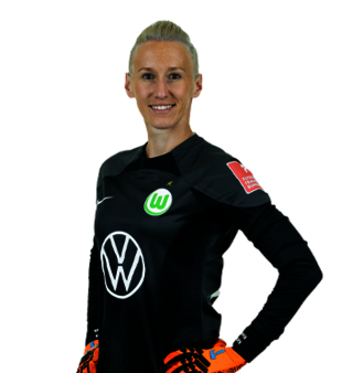 Katarzyna Kiedrzynek lächelt im schwarzen Torwarttrikot des VfL Wolfsburg in die Kamera.